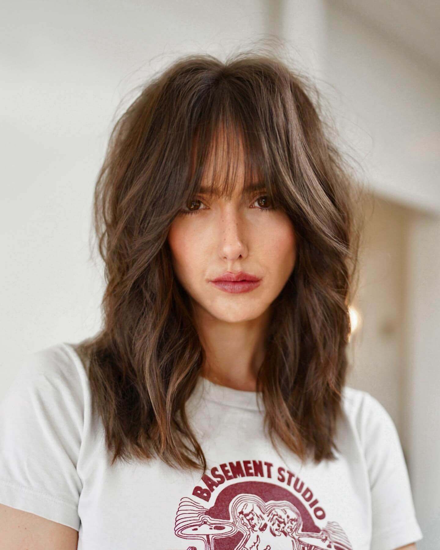 Medium-length tousled layers with see-through bangs
