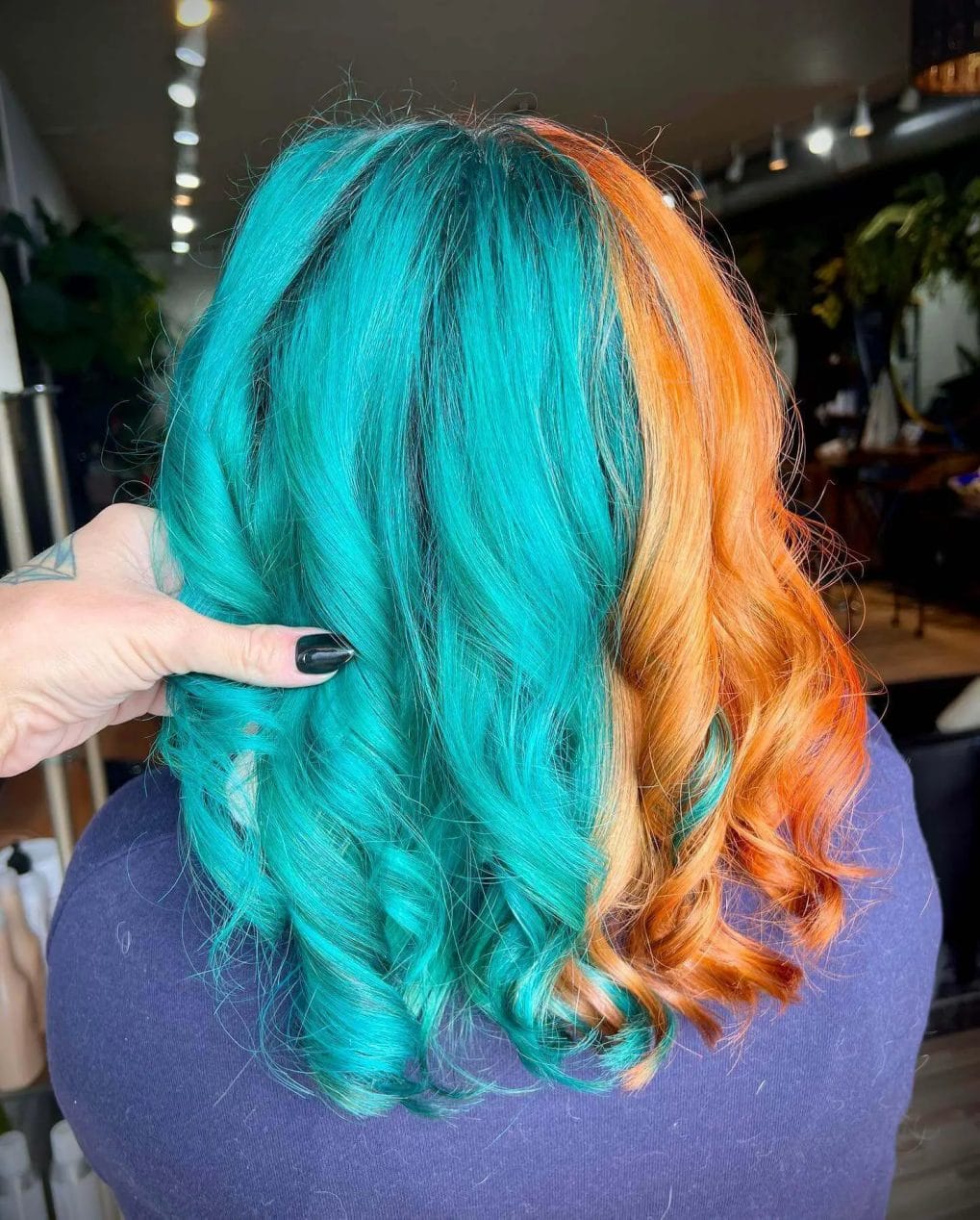 Adventurous turquoise and orange split dye with lively curls