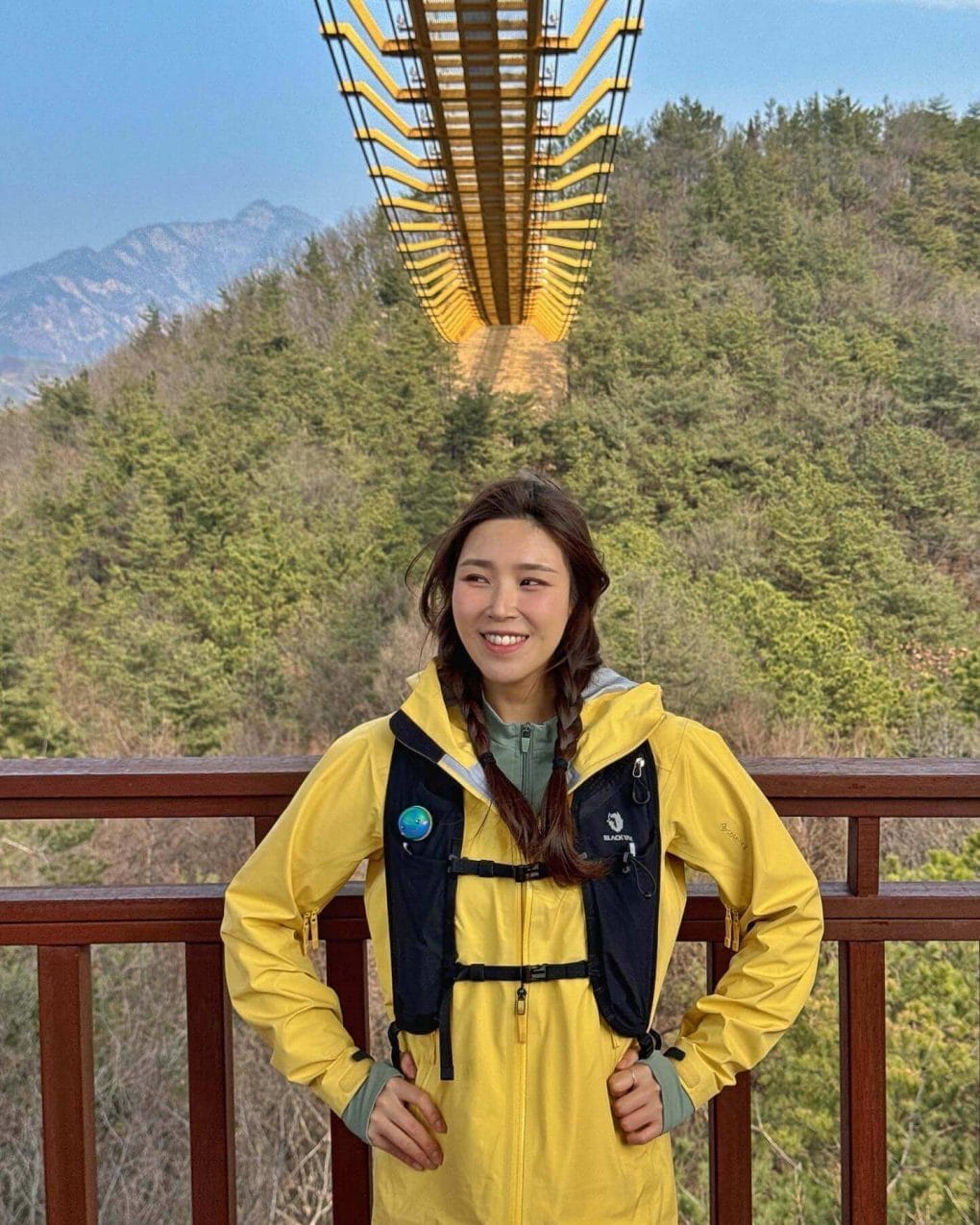 Hiker with relaxed twin braids enjoying the trail