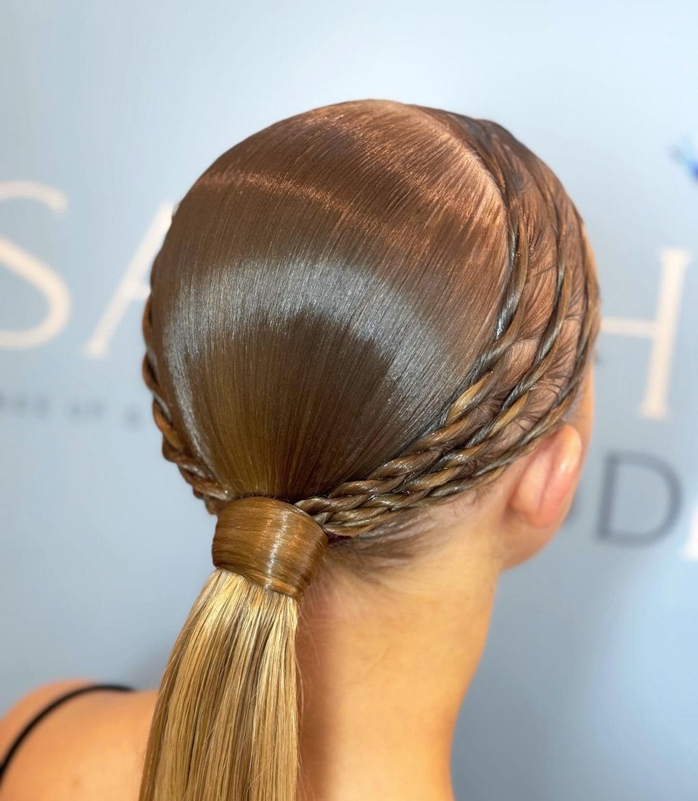 Smooth twisted crown leading to a long sleek ponytail
