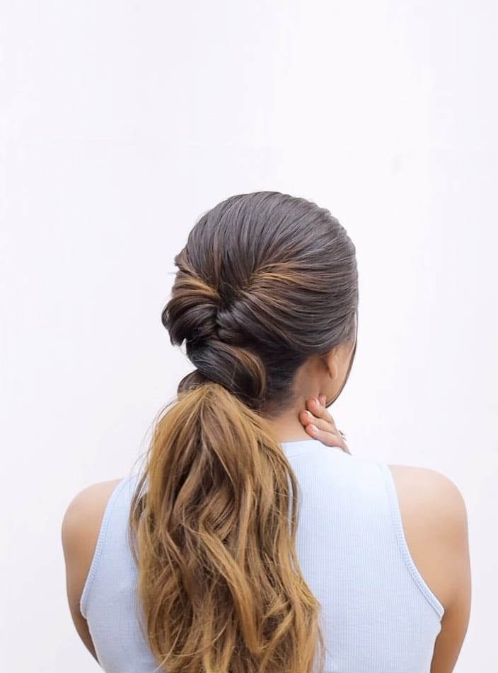 Smooth twisted half-up ponytail into soft ombre waves for versatile volleyball fashion