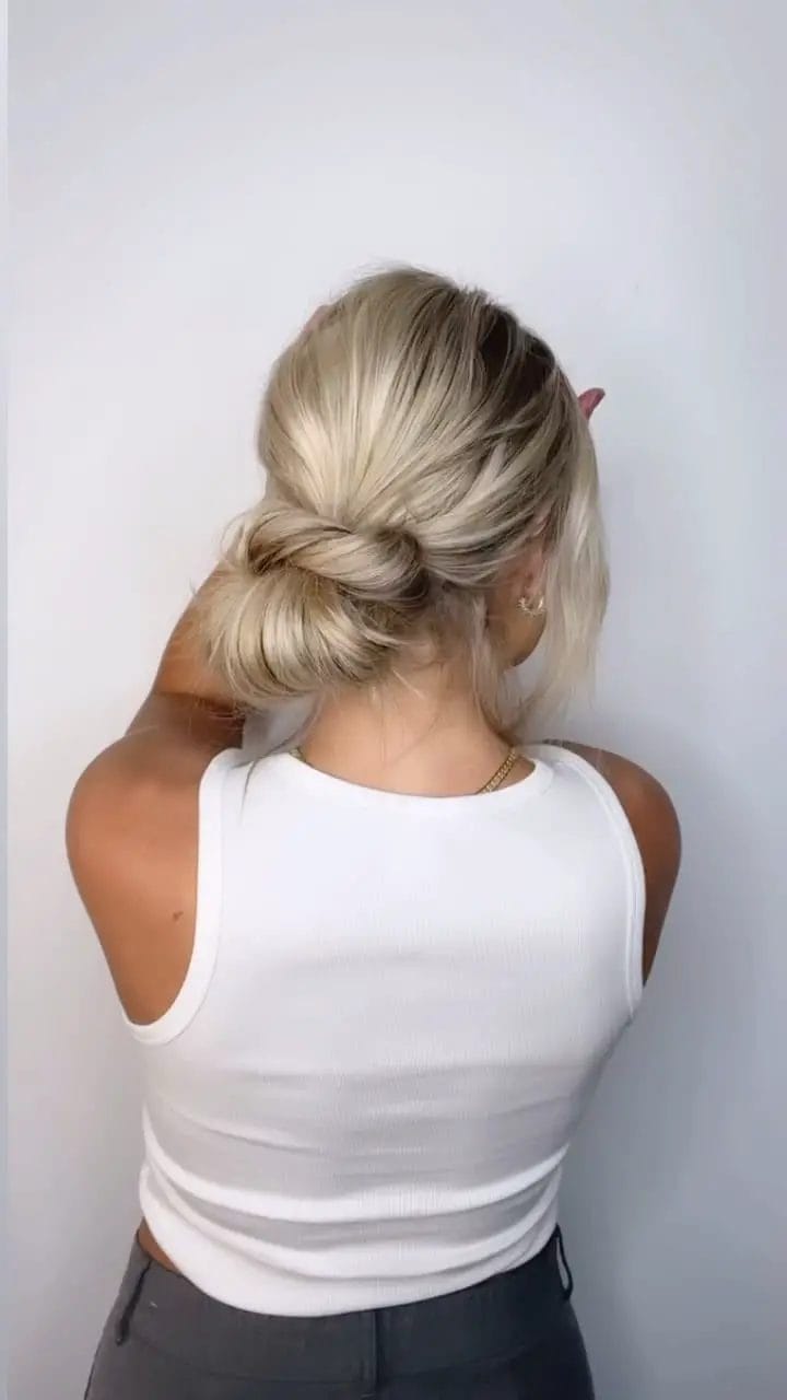 Relaxed low bun for versatile summer outings