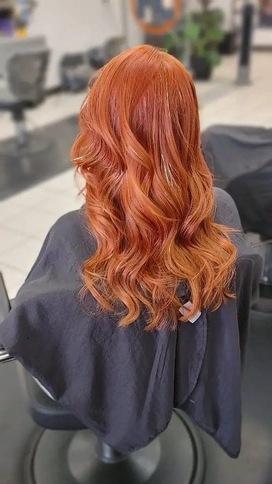 Vibrant copper-colored long curls for lush fullness