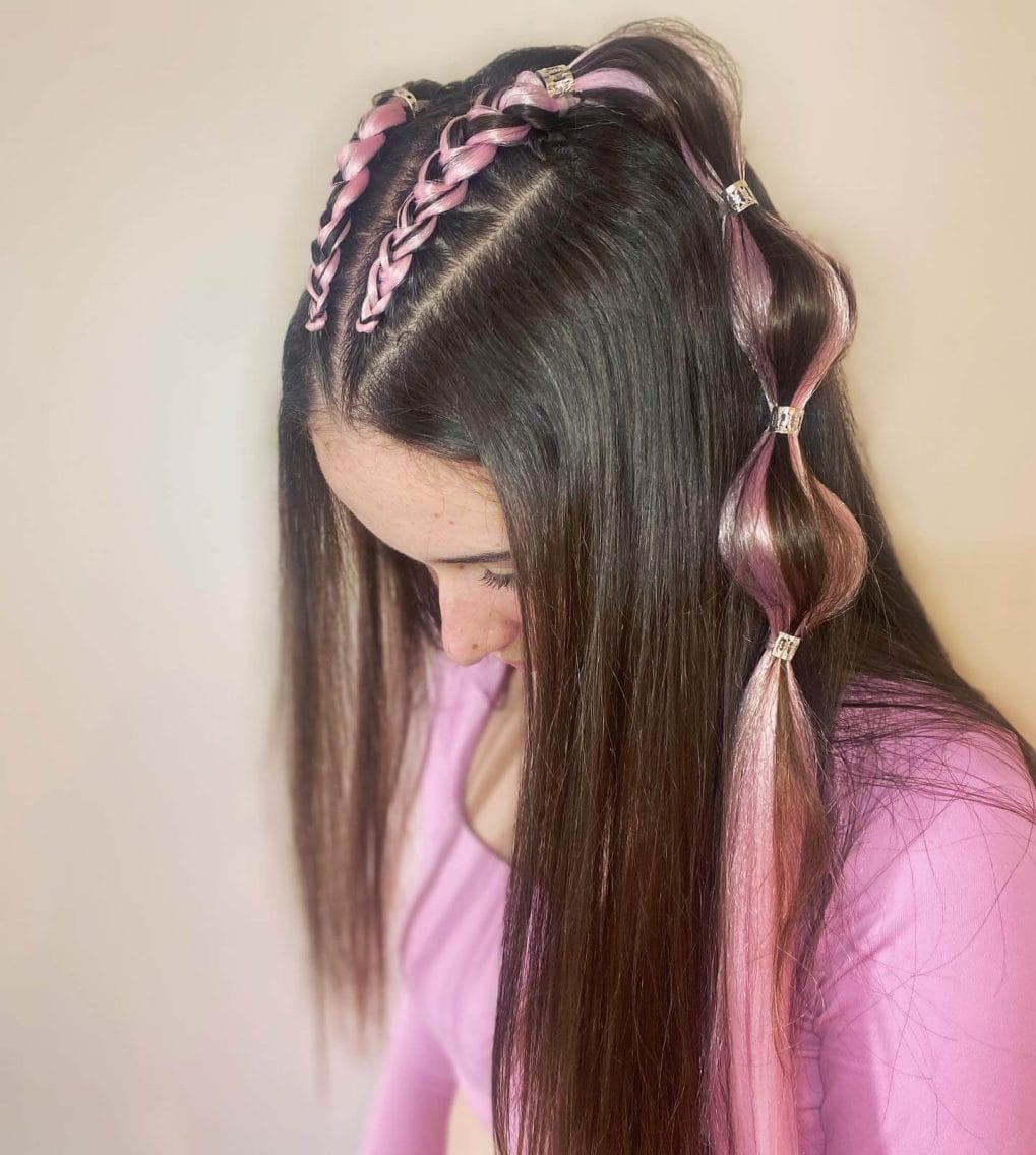 Dark hair with a bold ribbon woven through the braid