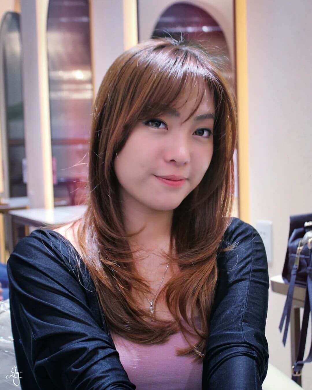 Long warm brown layers with see-through bangs