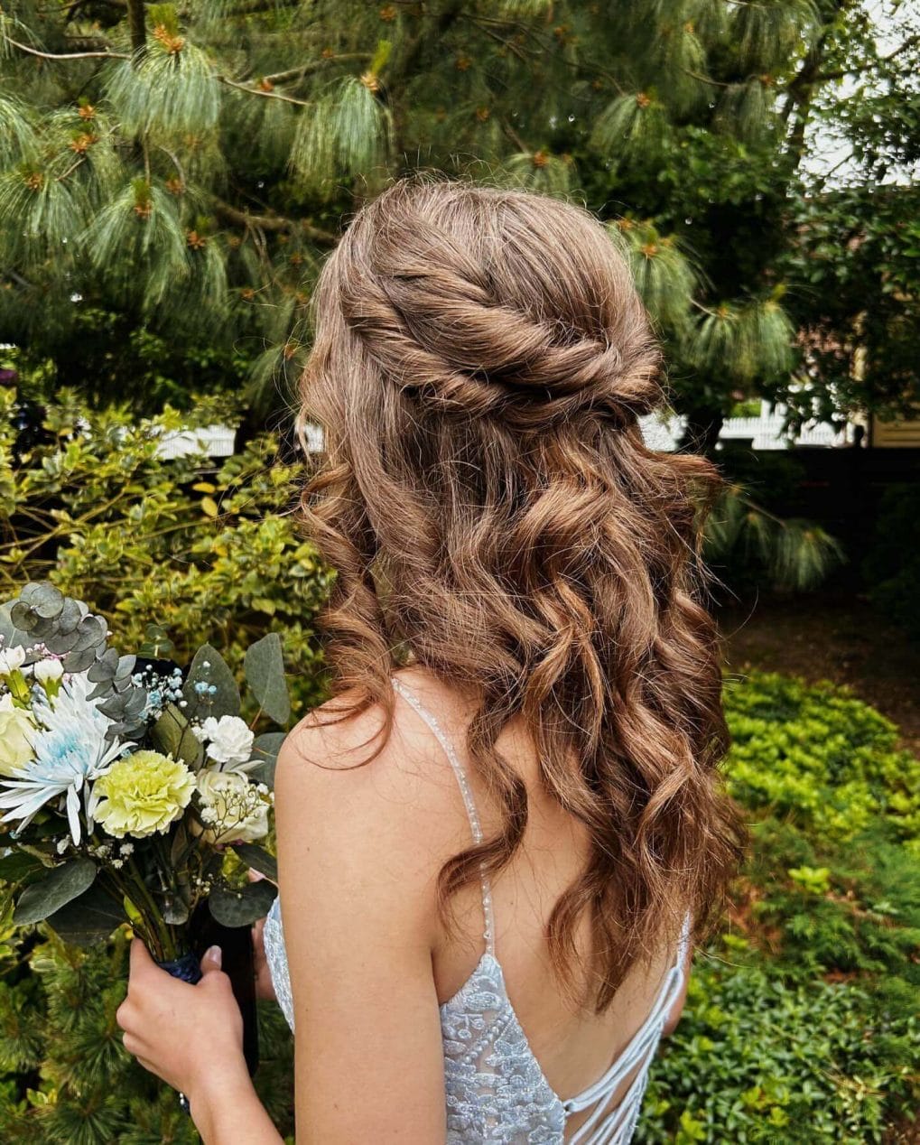 Wavy brunette hair with elegant half-up half-down style