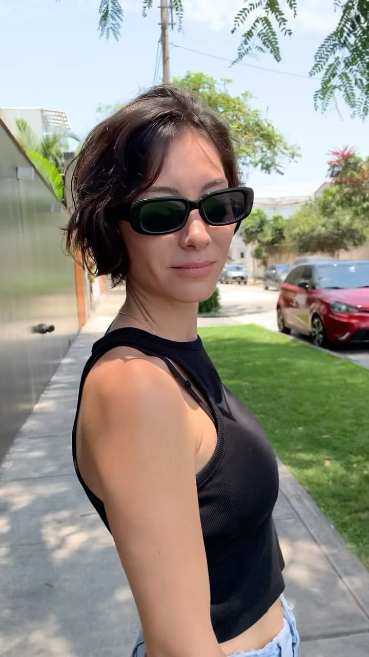 Wavy, espresso-toned French bob with deep side part