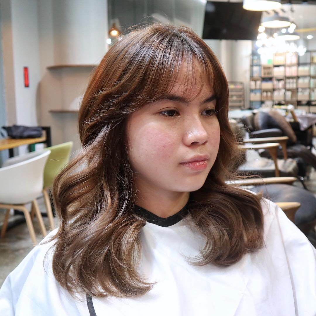 Brown waves with see-through bangs